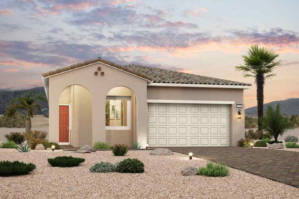 A house with a garage and palm trees.