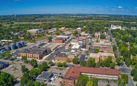 A city with many buildings and trees.