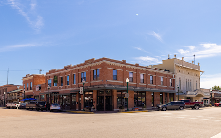 A parking lot in front of a building.