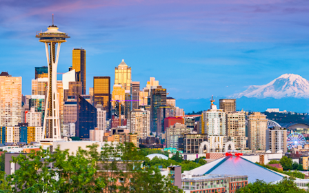 A city with a mountain in the background.