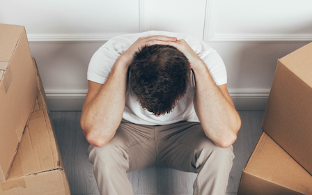 A man sitting in a box.