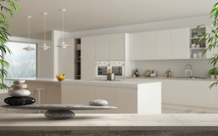 A kitchen with a table and a window.