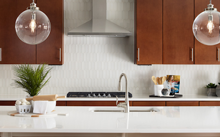 A kitchen with wooden cabinets.
