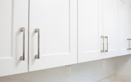 A white wall with white doors.