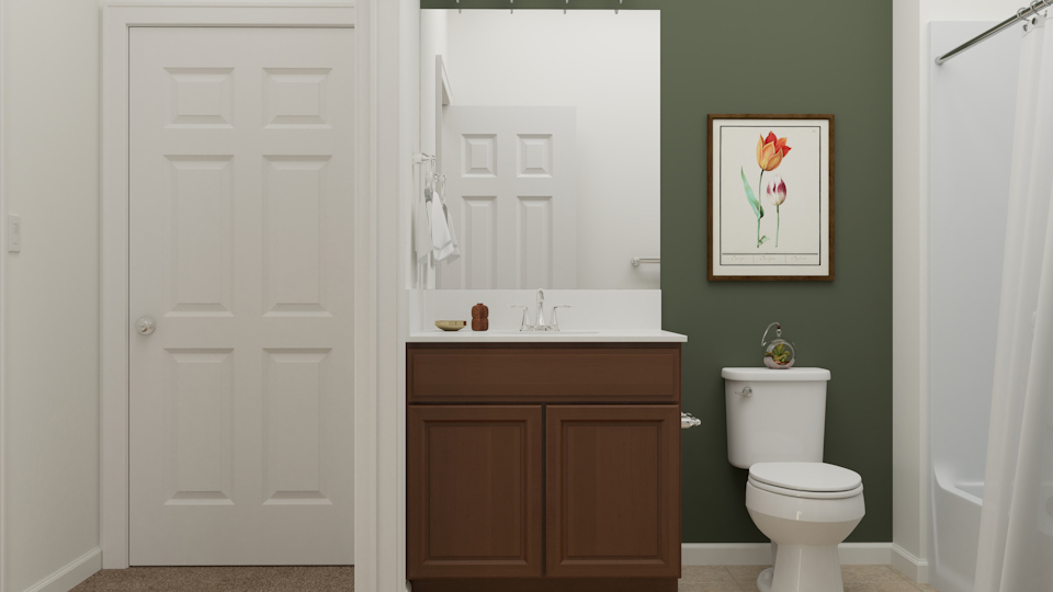 A bathroom with a toilet and a sink.