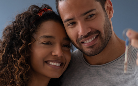 A man and a woman smiling.