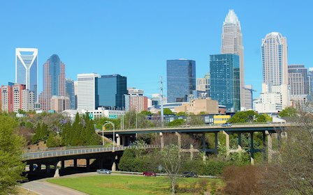 A bridge over a river in a city.