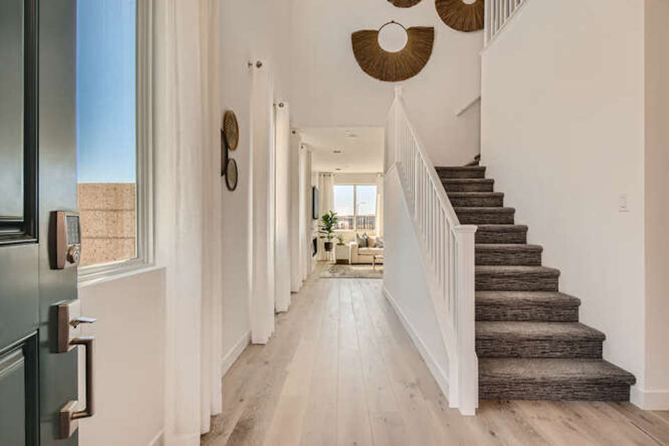 A long hallway with white walls.