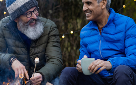 A group of people sitting outside.