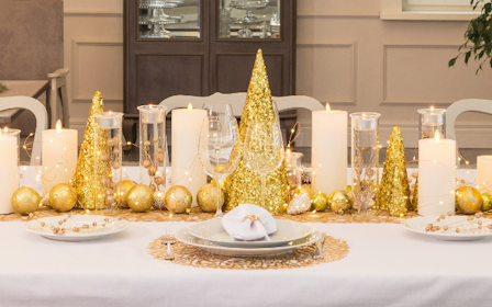A table with plates and glasses on it.