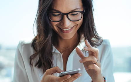 A woman holding a phone.