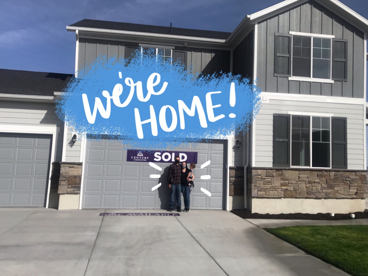 We're Home! A group of people standing outside a building.