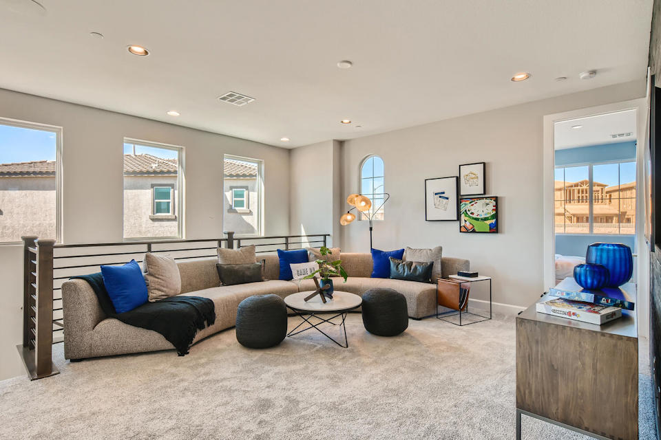 A living room with a couch and a coffee table.