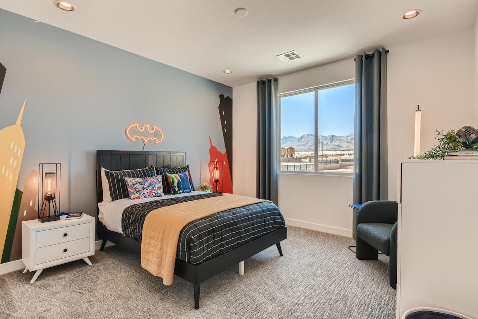 A bedroom with two beds.