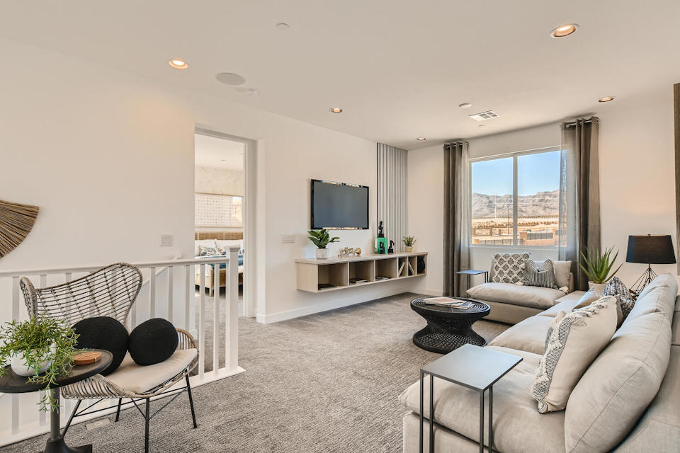 A living room with a tv and couches.