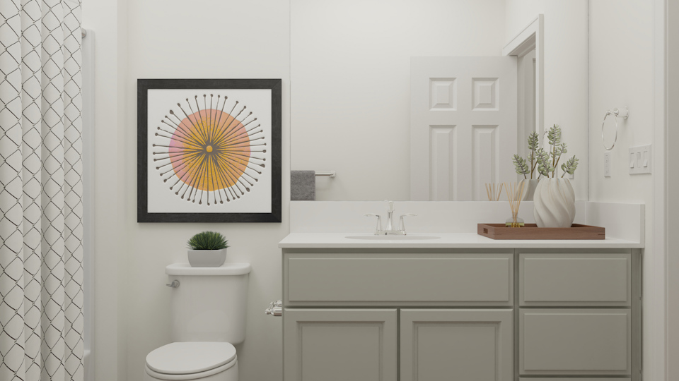 A bathroom with a white wall.