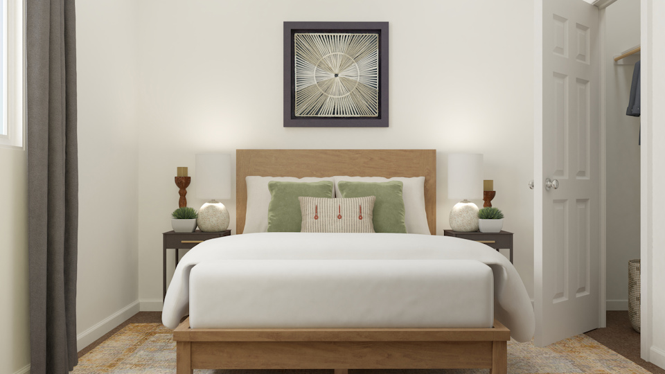 A bed with green pillows.