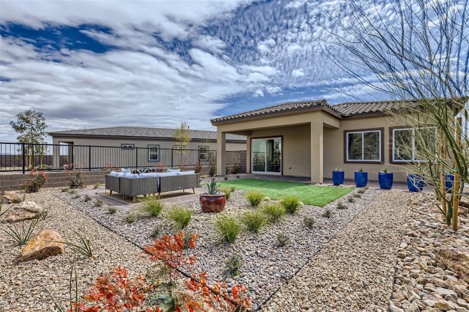 A house with a gravel yard.