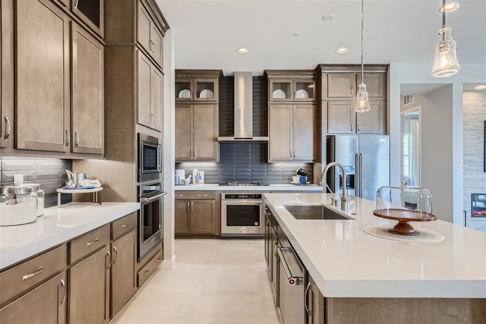 A kitchen with wooden cabinets.