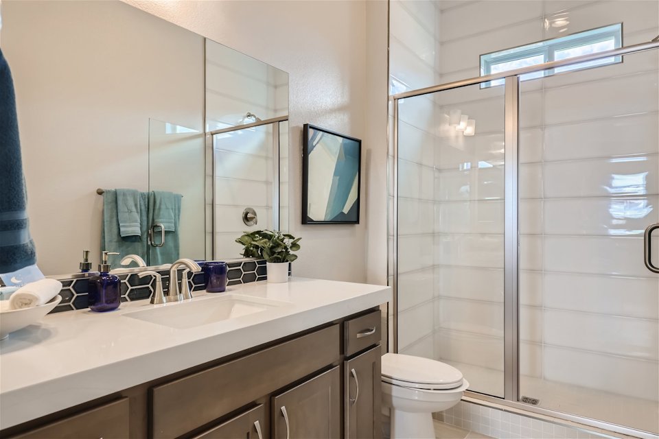 A bathroom with a glass shower.