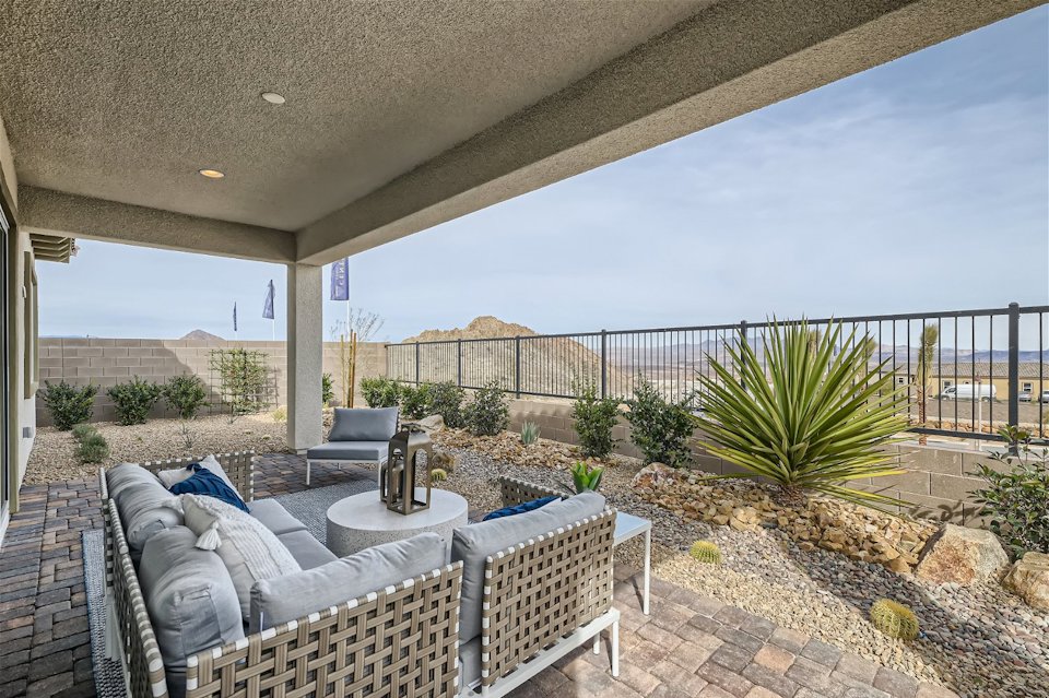 A patio with a patio and a patio with a view of the ocean.