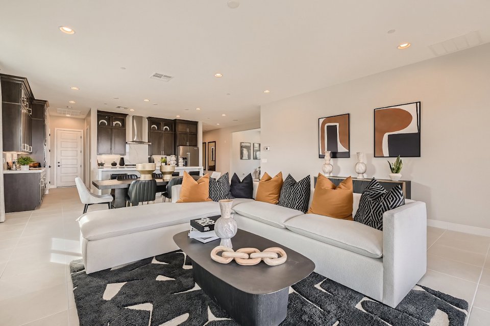 A living room with a couch and a table.