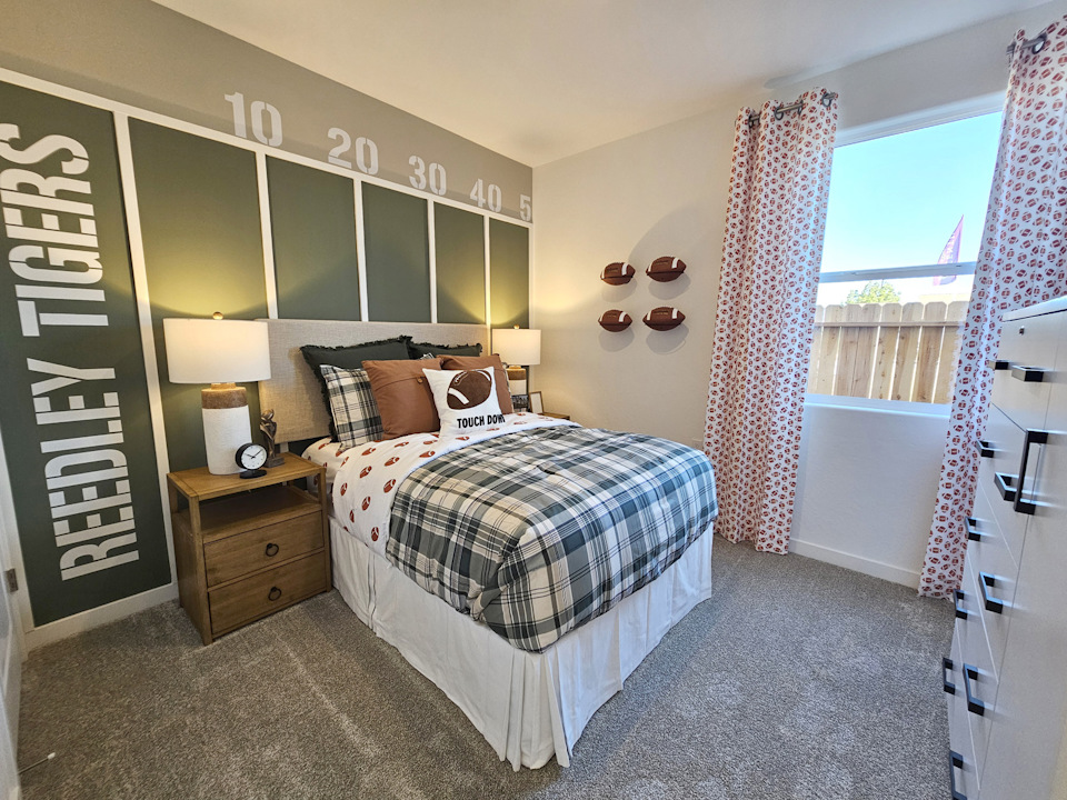 A bedroom with a bed and a window.