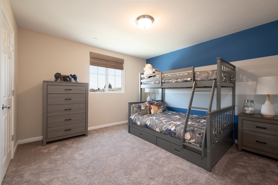 A bedroom with a bunk bed.