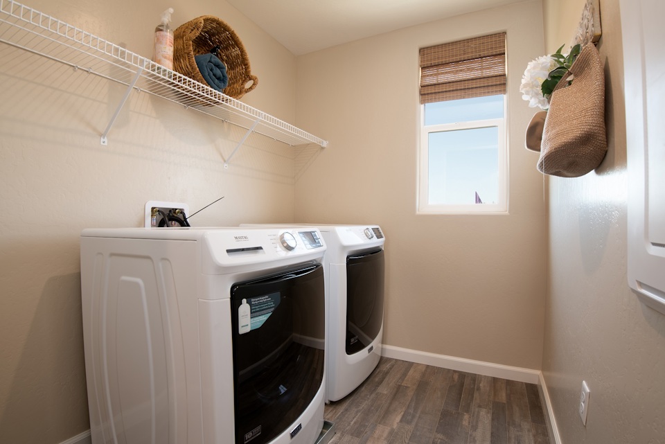 A washing machine in a room.