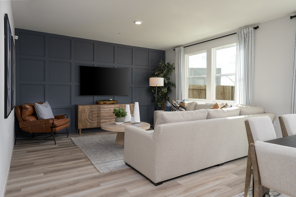 A living room with a tv and couches.