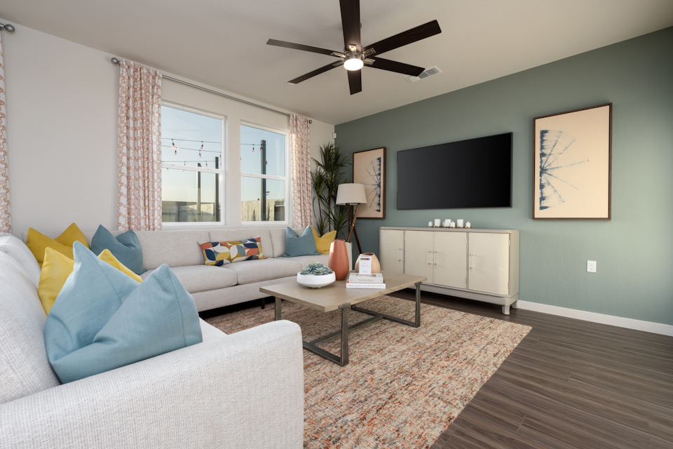 A living room with a tv and couches.