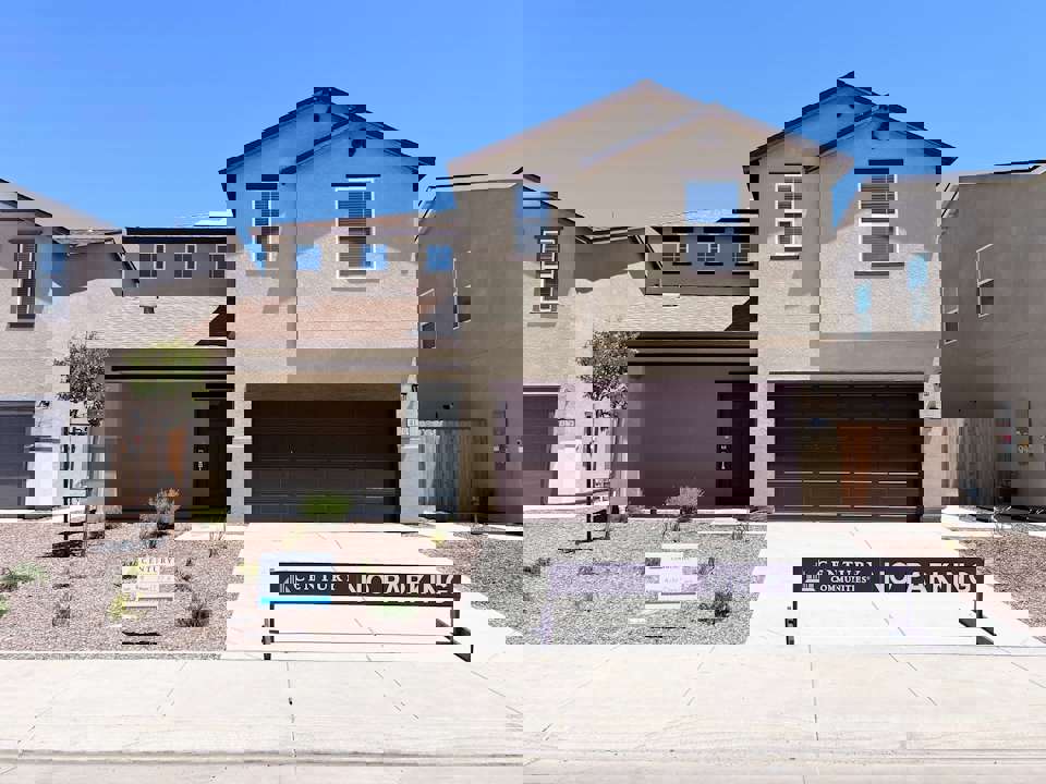 A building with a sign in front.