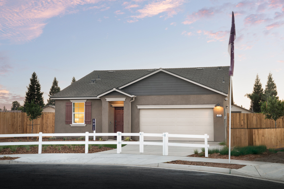 A house with a white picket fence.