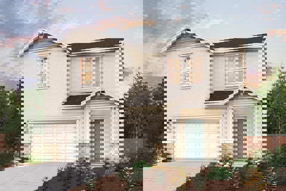 A house with a garage and bushes.