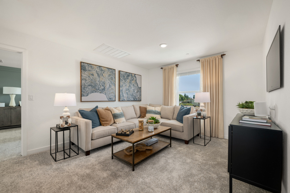 A living room with a couch and a coffee table.