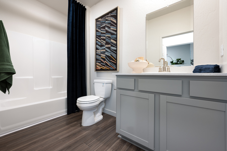 A bathroom with a toilet and sink.