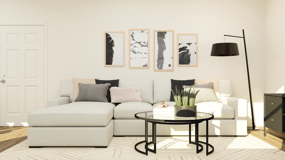 A living room with white furniture.