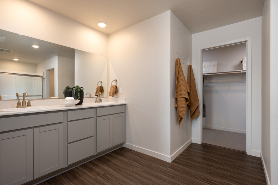 A bathroom with a sink and a shower.