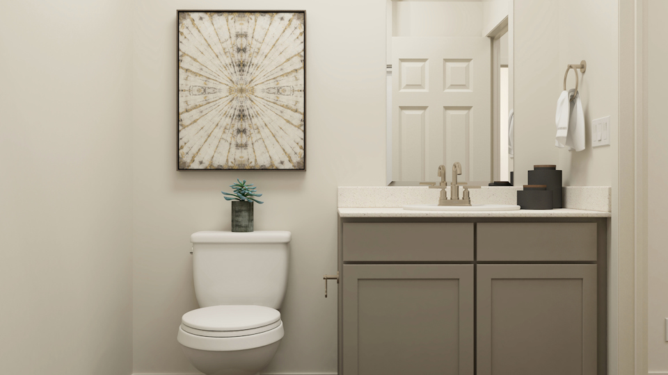 A bathroom with a toilet and sink.