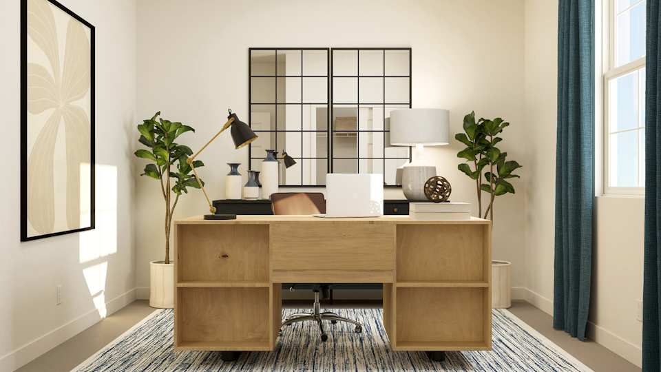 A room with a desk and a mirror.