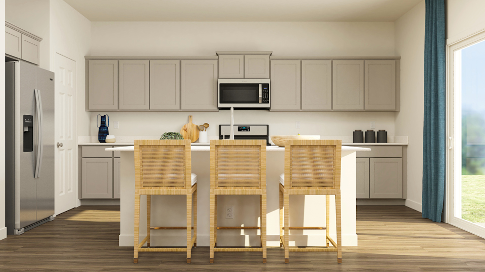 A kitchen with white cabinets.