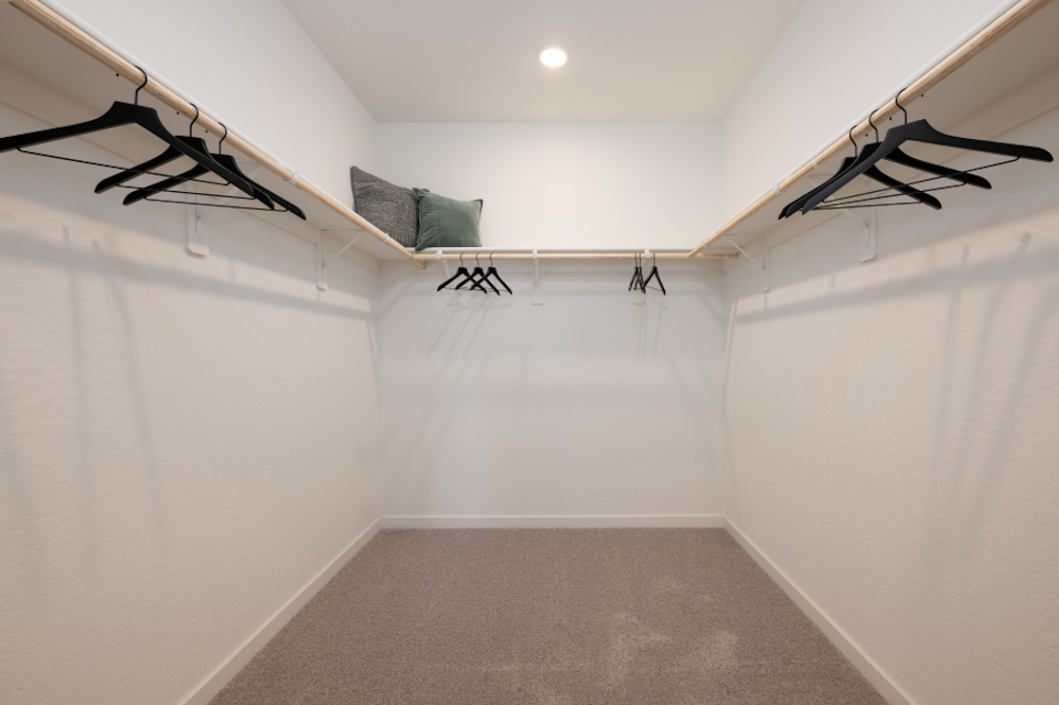 A room with white walls and a staircase.