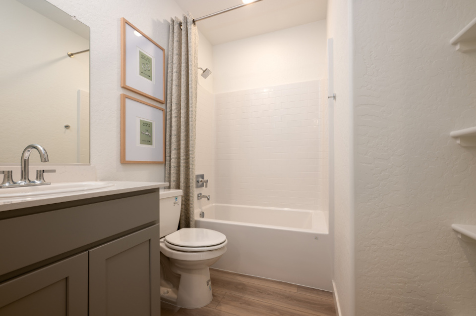 A bathroom with a toilet and sink.