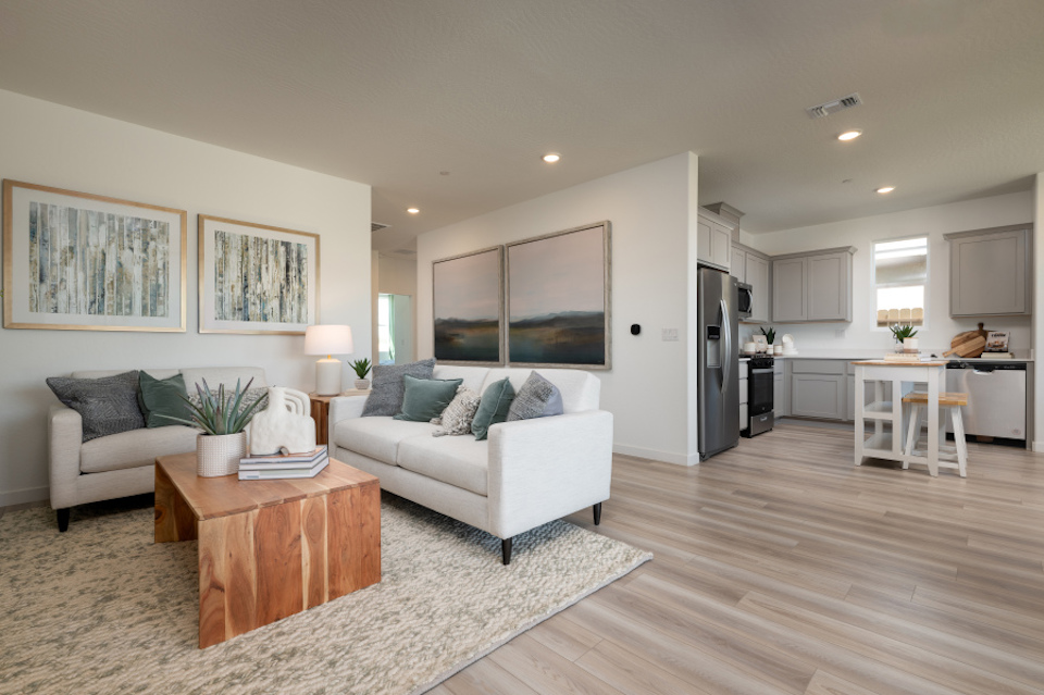 A living room with a wood floor.
