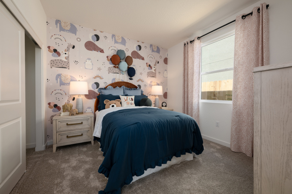 A bedroom with two beds.