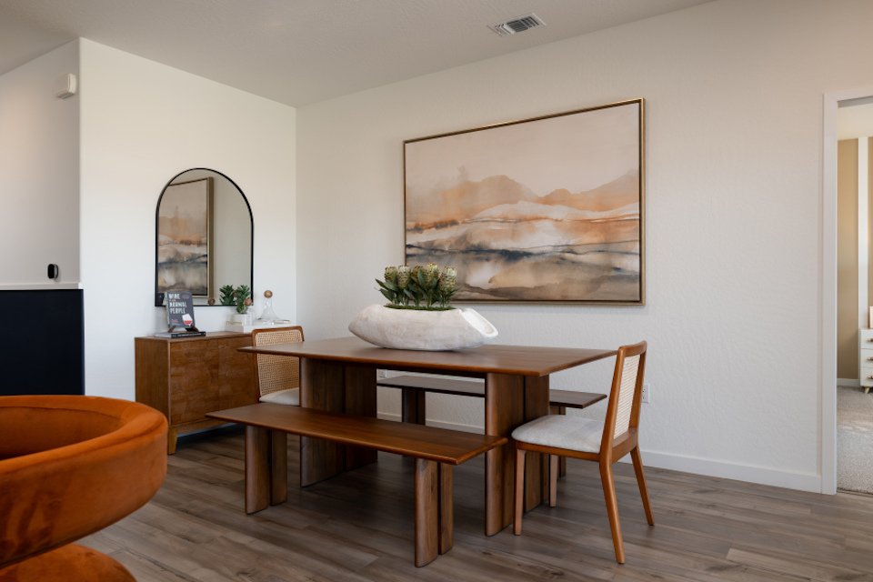 A room with a table and chairs.