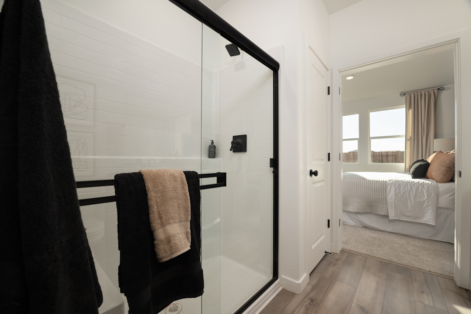 A closet with a glass door.