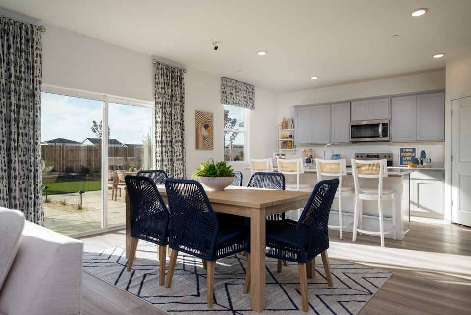 A dining room with a large window.