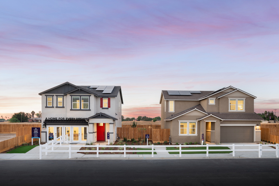 A house with a white picket fence.