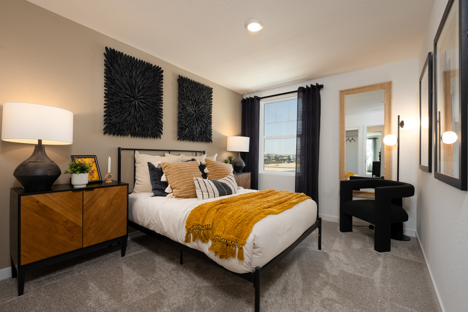 A bedroom with a bed and a desk.